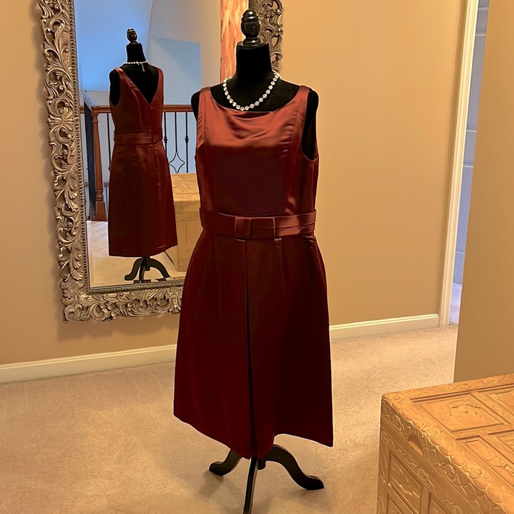 Beautiful wine cocktail dress with fitted top and inverted pleat A-line skirt.